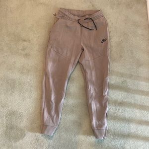 Small brown Nike sweatpants.
